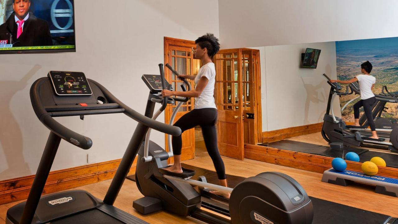 Drostdy Hotel Graaff-Reinet Екстериор снимка A woman using a cross trainer