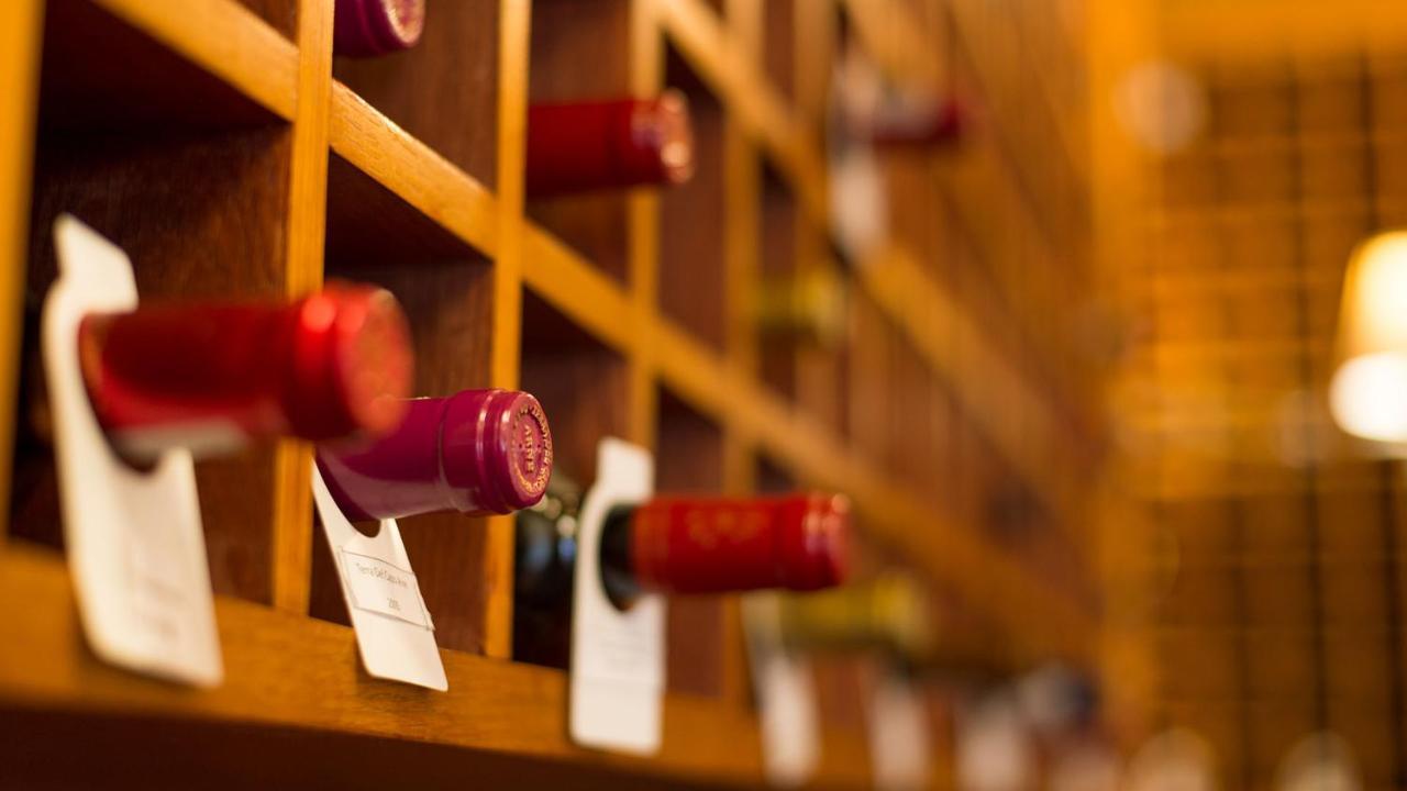 Drostdy Hotel Graaff-Reinet Екстериор снимка Wine bottles in a wine rack